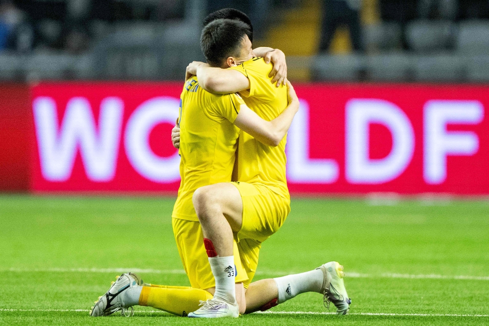 Players from Kasakhstan celebrates after winning the UEFA Euro 2024 Group H qualification football match Kasakhstan v Denmark in Astana, Kazakhstan on March 26, 2023. (Photo by Bo Amstrup / Ritzau Scanpix / AFP) 