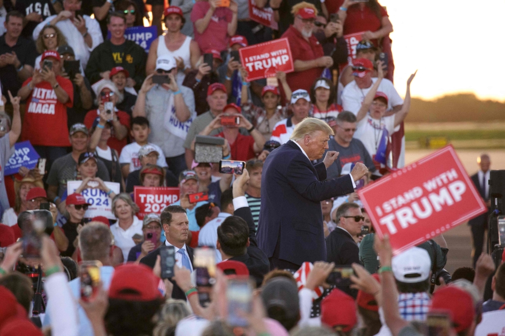 Former US President Donald Trump dances off the stage at the conclusion of a 2024 election campaign rally in Waco, Texas, March 25, 2023. - Trump held the rally at the site of the deadly 1993 standoff between an anti-government cult and federal agents. (Photo by Shelby Tauber / AFP)