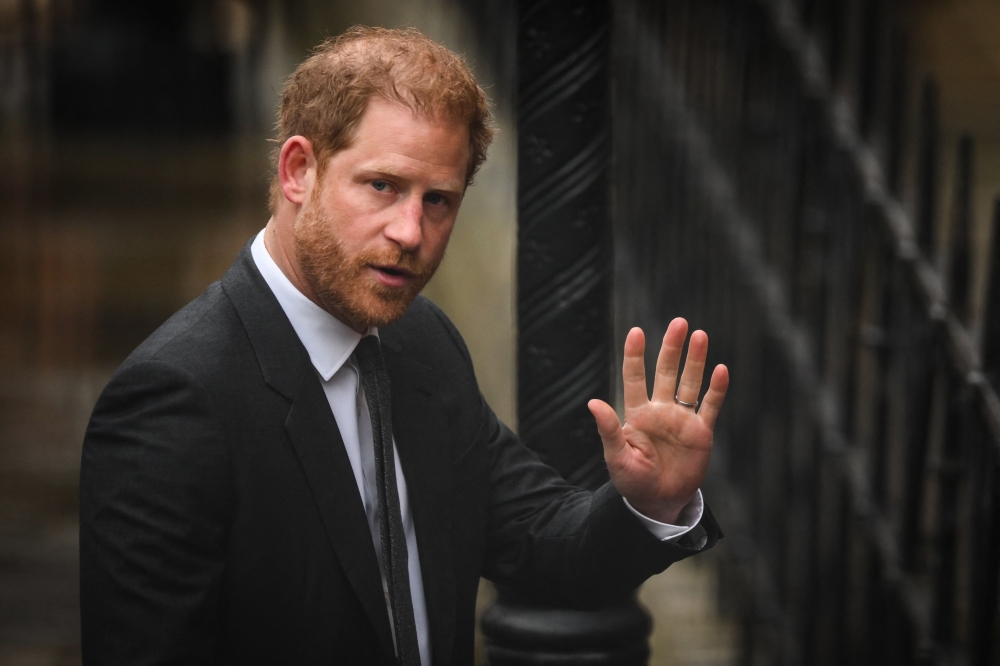 Britain's Prince Harry, Duke of Sussex waves as he arrives at the Royal Courts of Justice, Britain's High Court, in central London on March 28, 2023. (Photo by Daniel Leal / AFP)