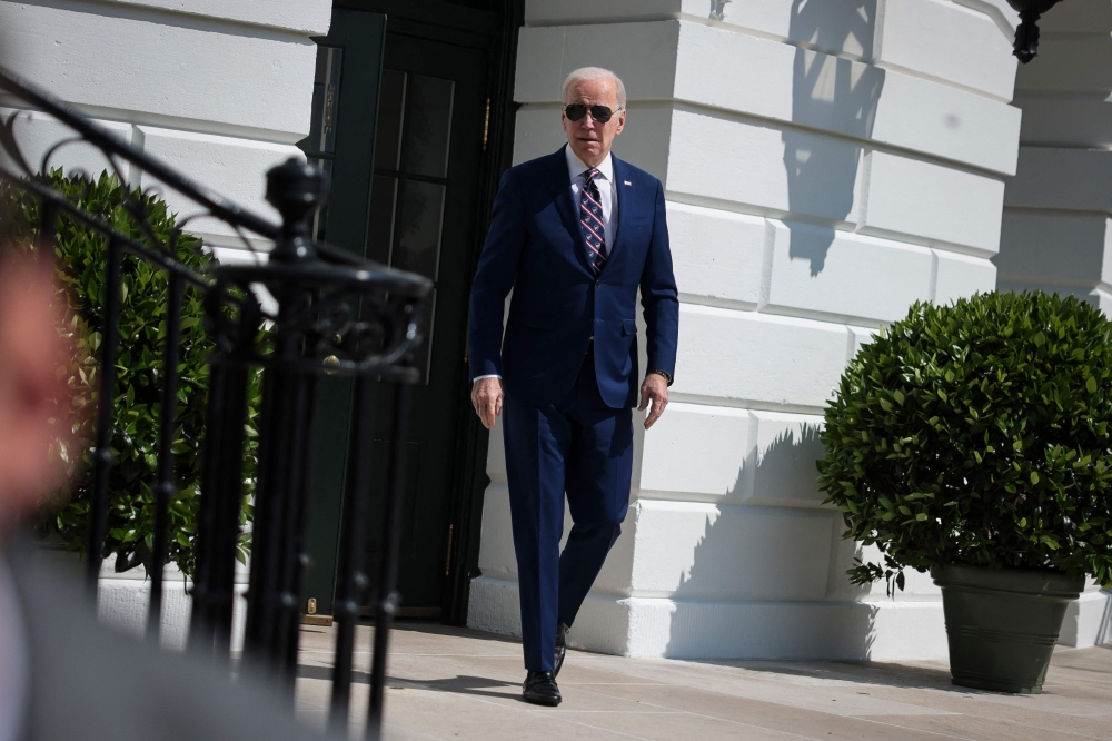 US President Joe Biden walks to board Marine One on the South Lawn of the White House in Washington, DC, on March 28, 2023.  (Photo by Oliver Contreras / AFP)