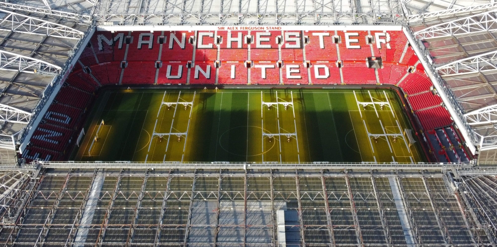 An aerial file photo taken on November 23, 2022 shows Old Trafford stadium, home ground of to Manchester United football team, in Manchester, northern England. (Photo by Oli Scarff / AFP)