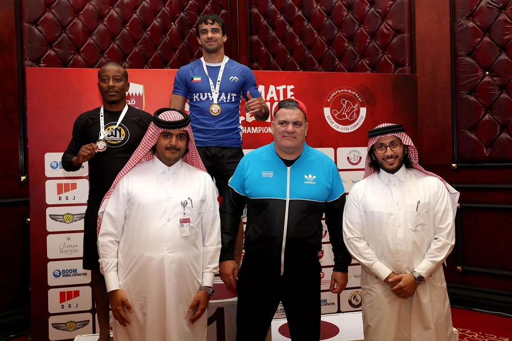 QWF President Sheikh Fahad bin Khalid Al Thani with martial arts expert Rigan Machado at a medals presentation ceremony. 