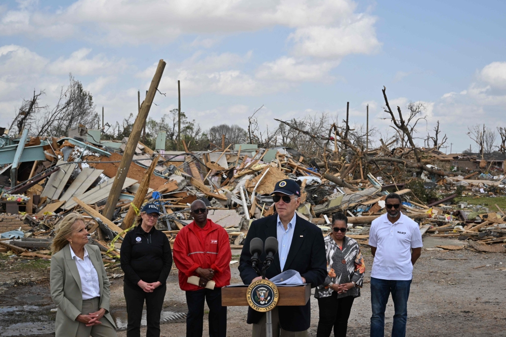 US President Joe Biden speaks during a press conference in a storm-stricken area of Rolling Fork, Mississippi, on March 31, 2023. - The Bidens are visiting Rolling Fork, Mississippi, a week after it was devastated by a tornado that ripped through the southern state, killing at least 25 people. (Photo by Mandel NGAN / AFP)