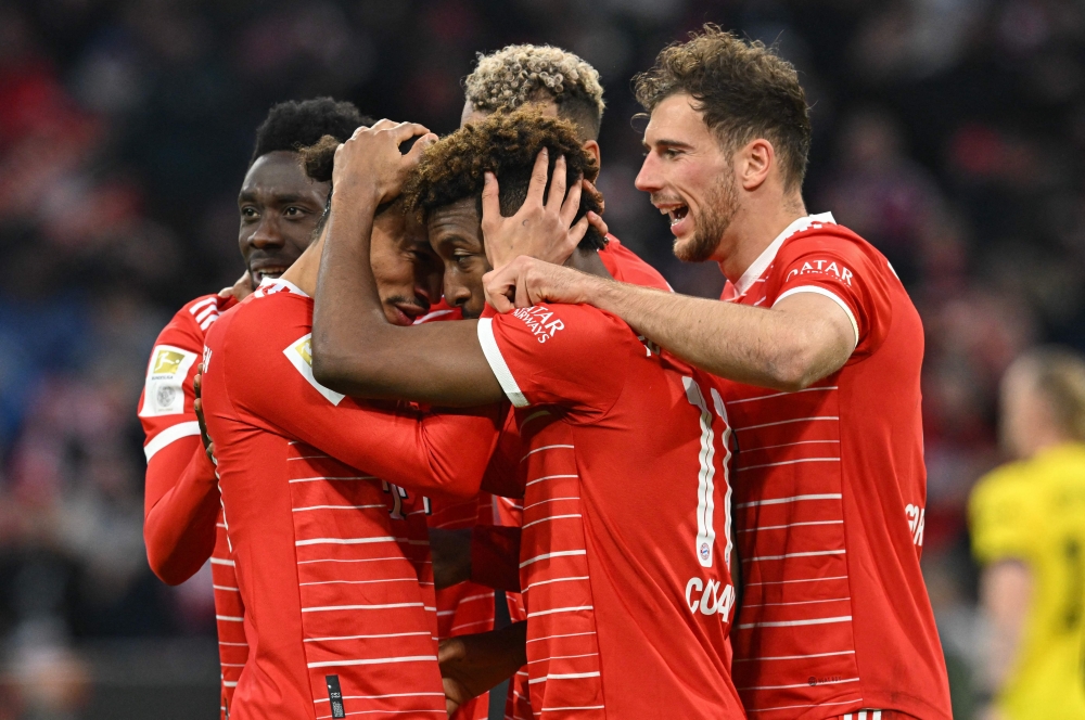 Bayern Munich's team celebrate a goal during the German first division Bundesliga football match between FC Bayern Munich and BVB Borussia Dortmund in Munich, southern Germany, on April 1, 2023. (Photo by KERSTIN JOENSSON / AFP)
