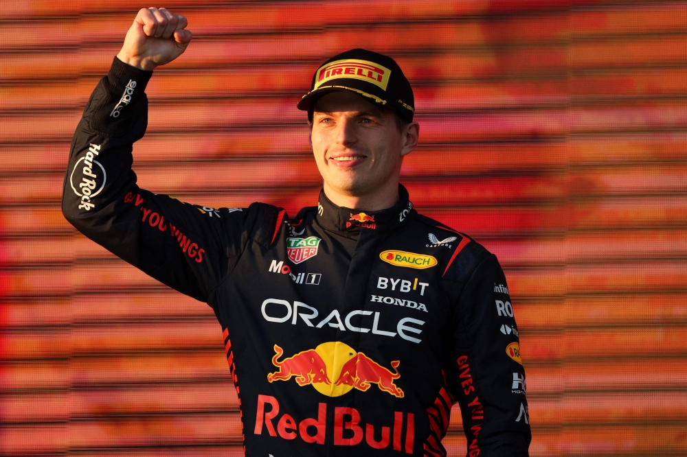 Red Bull Racing's Dutch driver Max Verstappen celebrates victory on the podium after the 2023 Formula One Australian Grand Prix at the Albert Park Circuit in Melbourne on April 2, 2023. Photo by Martin KEEP / AFP