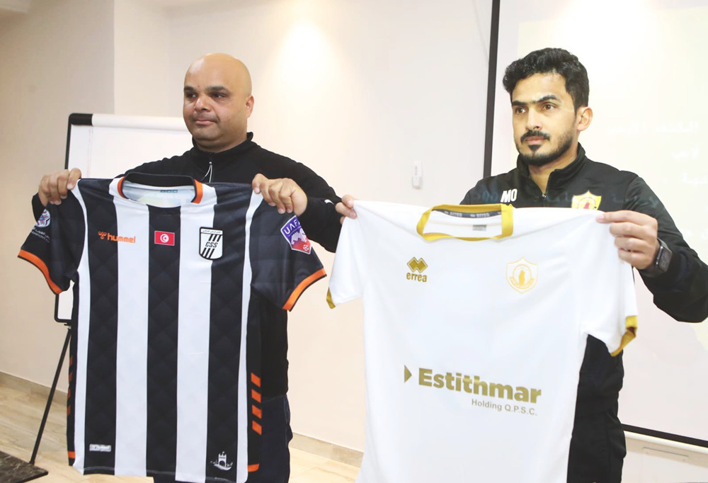 Representatives of the clubs pose with team jerseys yesterday. 