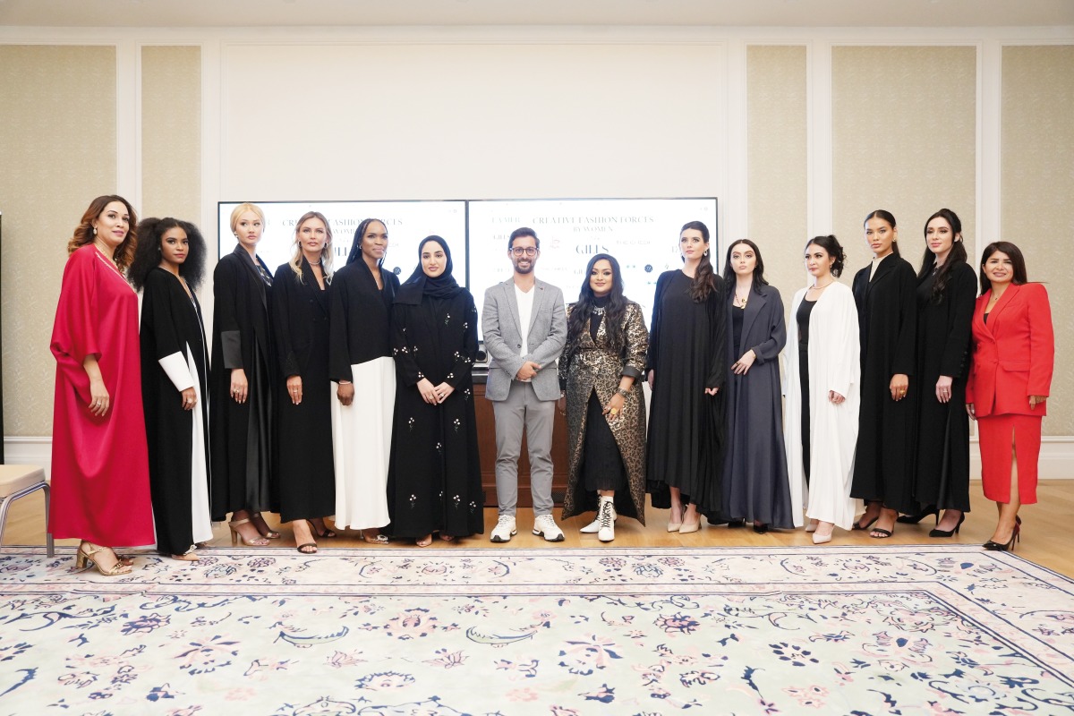 Qatar-based entrepreneurs, designers and models pose with Gills Manjulakshmi (seventh right) who hosted ‘Creative Fashion Forces by Women’.