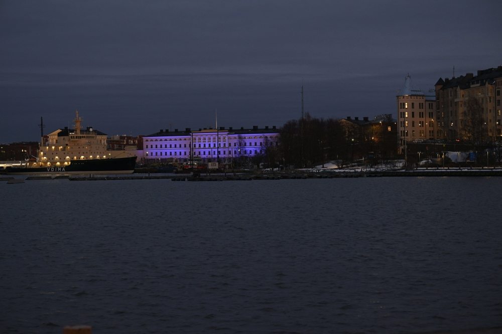 The building of the Foreign Ministry is illuminated to mark Finland joining NATO in Helsinki, Finland, on April 4, 2023. (Photo by Markku Ulander / Lehtikuva / AFP)