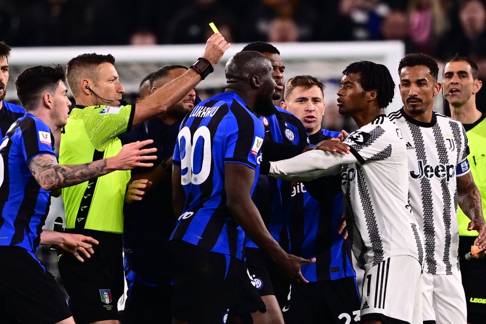 Inter Milan’s forward Romelu Lukaku (centre) argues with Juventus’ midfielder Juan Cuadrado from Colombia during the Italian Cup semi-final first leg football match between Juventus and Inter Milan on April 4 2023 at the 