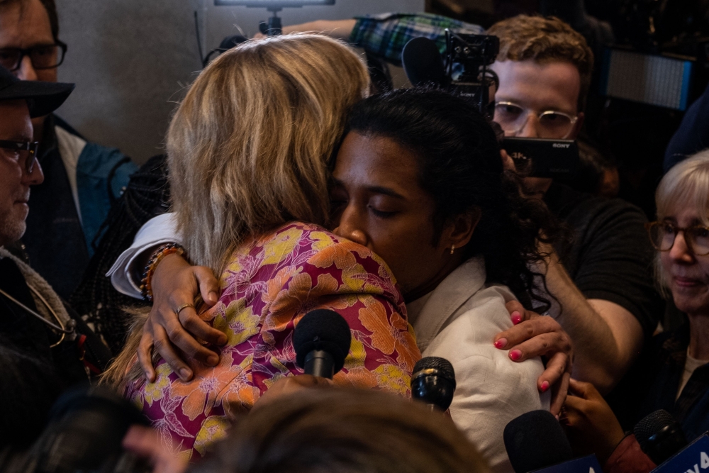 Democratic state Reps. Gloria Johnson (left) and Justin Jones embrace after a vote that expelled Jones from the governing body on April 6, 2023 in Nashville, Tennessee. (Photo by Seth Herald / Getty Images via AFP)

