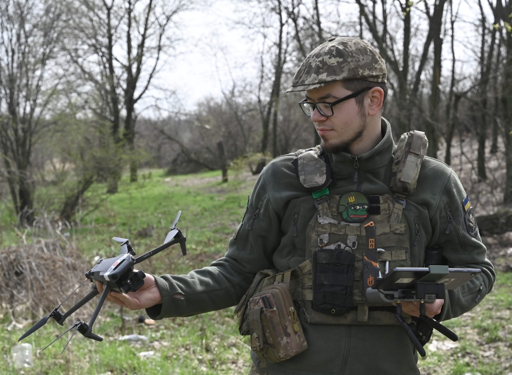 Ukrainian serviceman Oleksandr, a drone pilot of the 5 Separate Assault Brigade, attends a training exercise in the Donetsk region on April 7, 2023, amid the Russian invasion of Ukraine. (Photo by Genya Savilov / AFP)