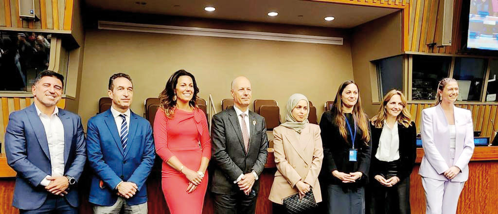 Permanent Representative of the State of Qatar to the UN H E Sheikha Alya Ahmed bin Saif Al Thani  (fourth right) with other officials during the celebration.