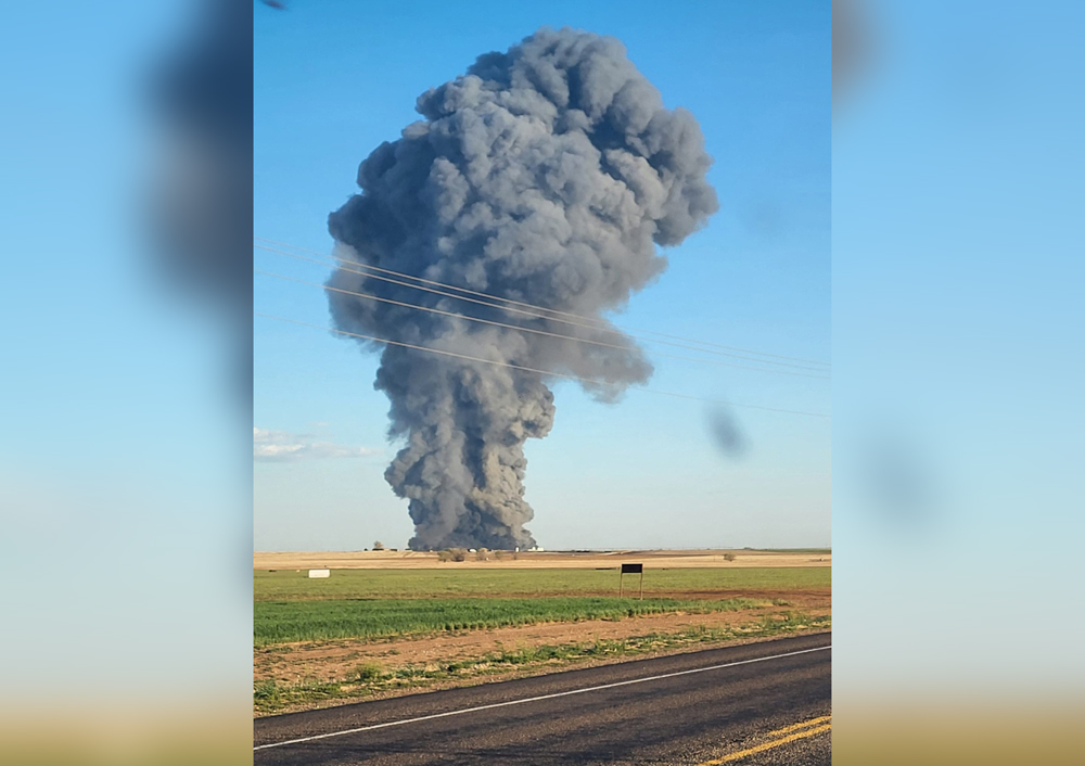 This image obtained from the Facebook page of Castro County Sheriff's Office shows a plume of smoke rising from the Southfork Dairy Farms, after an explosion and a fire killed around 18,000 cows, near Dimmitt, Texas, on April 11, 2023. Photo by Castro County Sheriff's Office / AFP
