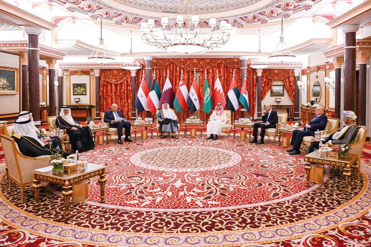 Prime Minister and Minister of Foreign Affairs H E Sheikh Mohamed bin Abdulrahman bin Jassim Al Thani with other participants during the meeting.