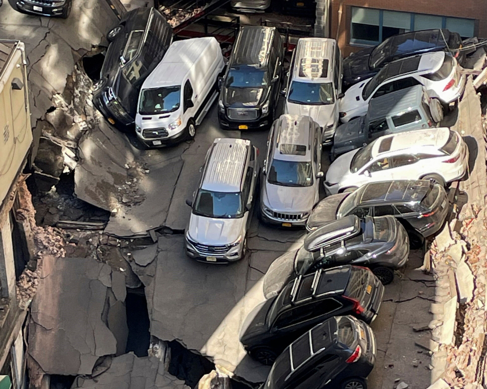 This image courtesy of @MobileHealthInc shows a collapsed parking garage in lower Manhattan, New York, April 18, 2023. Photo by MobileHealthInc / AFP