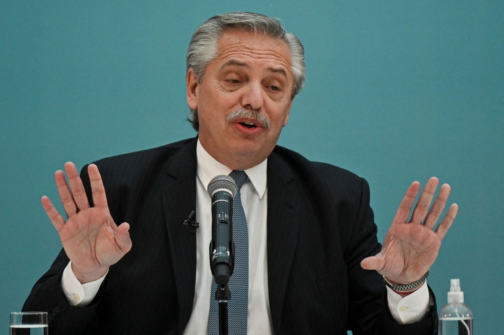 In this file photo taken on July 22, 2022, Argentine President Alberto Fernandez speaks during a government act at the Bicentennial Museum in Buenos Aires. (Photo by Luis Robayo / AFP)