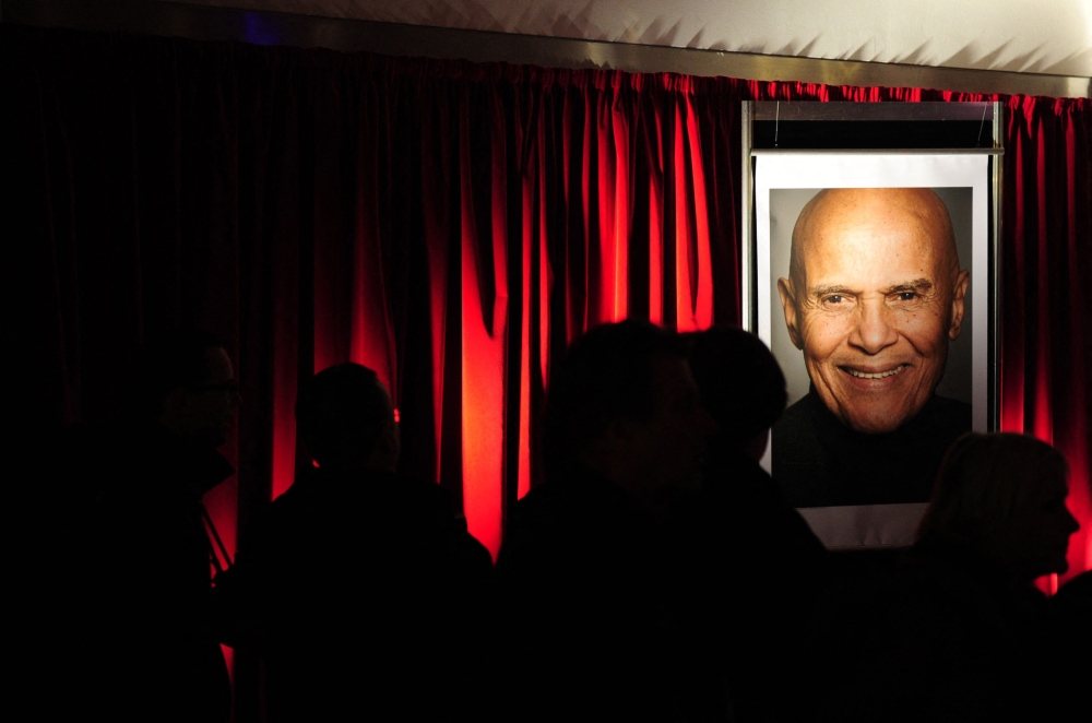 In this file photo taken on February 13, 2011 a giant photo of US singer Harry Belafonte can be seen at a screening of the film 