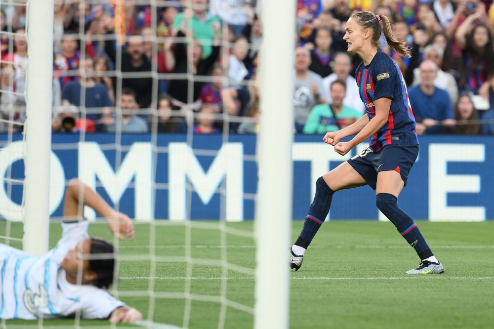 Barcelona's Norwegian forward Caroline Hansen celebrates after scoring her team's first goal during the UEFA Champions League semi-final second leg football match between FC Barcelona and Chelsea at the Camp Nou stadium in Barcelona on April 27, 2023. (Photo by LLUIS GENE / AFP)