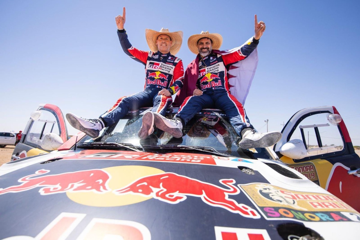 Qatari driver Nasser Al Attiyah celebrates with his French co-driver Mathieu Baumel celebrate after winning the Sonora Rally.