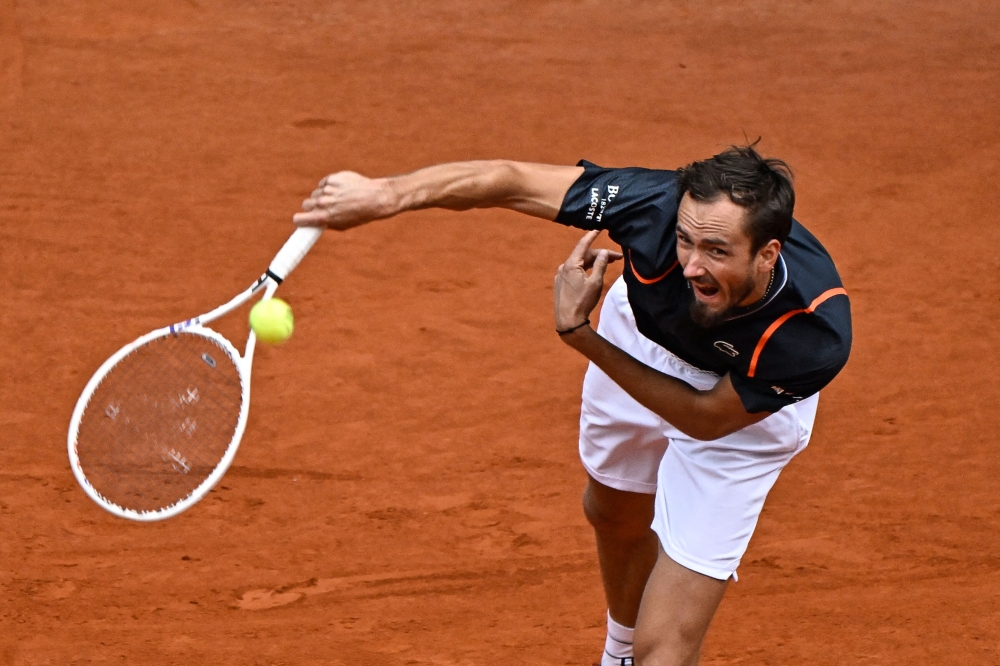 Russia's Daniil Medvedev serves the ball to Italy's Andrea Vavassori during their 2023 ATP Tour Madrid Open tennis tournament singles match at the Caja Magica in Madrid on April 29, 2023. (Photo by OSCAR DEL POZO / AFP)