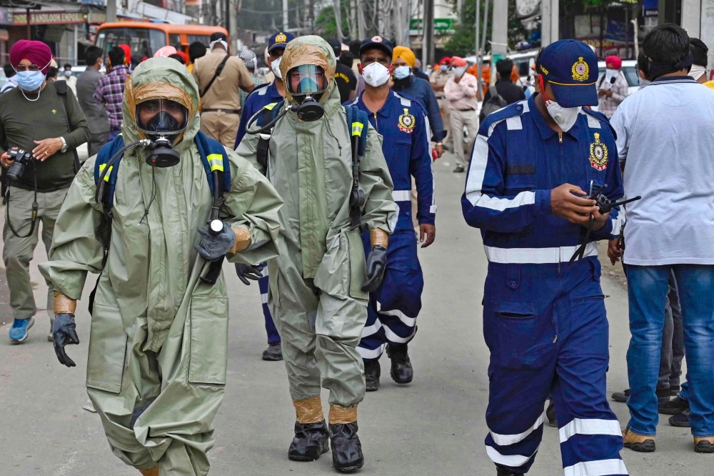 National Disaster Response Force (NDRF) personnel arrive to inspect the gas leak accident at a factory in Ludhiana on April 30, 2023. Photo by AFP