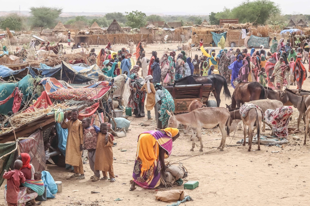 Sudanese refugees from the Tandelti area who crossed into Chad, in Koufroun, near Echbara, are seen on April 30, 2023. (Photo by Gueipeur Denis Sassou / AFP)