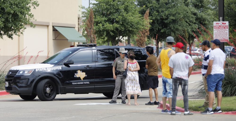 Residents return in an effort to retrieve their vehicles at the scene of a shooting at Allen Premium Outlets on May 7, 2023 in Allen, Texas. (Photo by Stewart F. House / Getty Images via AFP)