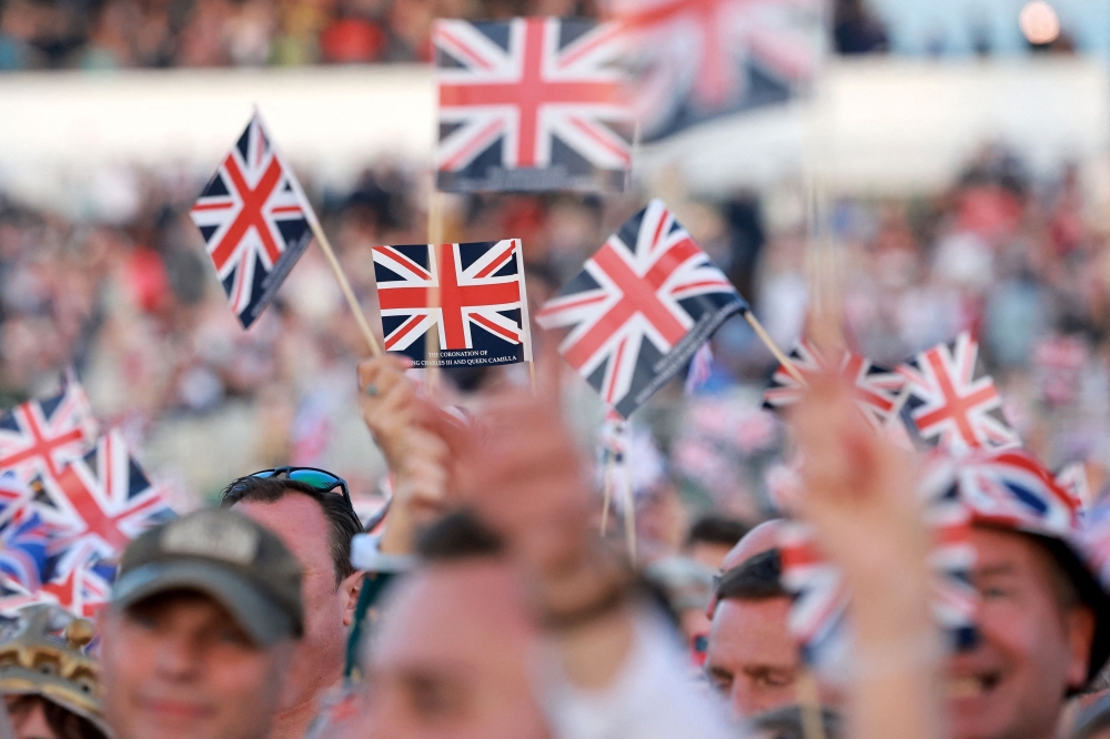 Crowds gather inside Windsor Castle grounds ahead of the Coronation Concert, in Windsor, west of London on May 7, 2023. Photo by Chris Jackson / POOL / AFP