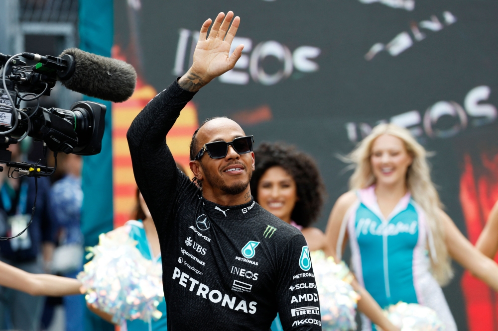 MAY 07: Lewis Hamilton of Great Britain and Mercedes walks out onto the grid prior to the F1 Grand Prix of Miami at Miami International Autodrome on May 07, 2023 in Miami, Florida. Photo by Chris Graythen / GETTY IMAGES NORTH AMERICA / Getty Images via AFP