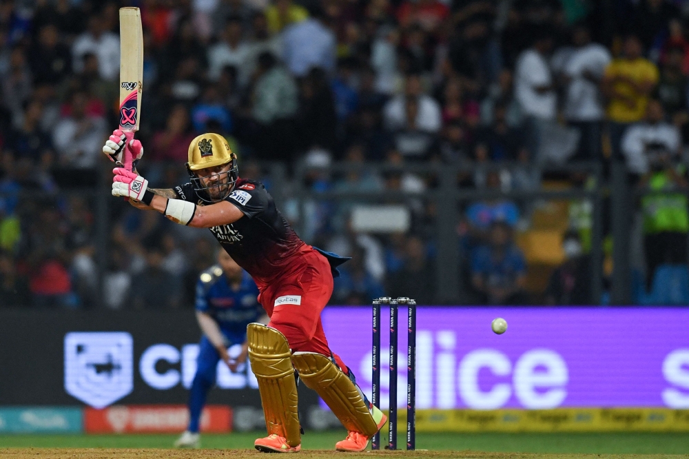 Royal Challengers Bangalore's Faf du Plessis plays a shot during the Indian Premier League (IPL) Twenty20 cricket match between Mumbai Indians and Royal Challengers Bangalore at the Wankhede Stadium in Mumbai on May 9, 2023. (Photo by Indranil Mukherjee / AFP)