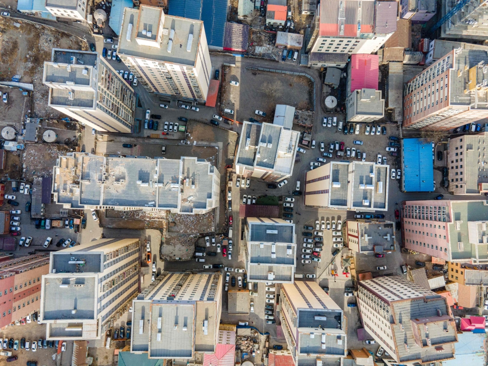 This photo taken on April 16, 2023 shows an aerial view of residential buildings in Mongolia's capital Ulaanbaatar. (Photo by Byambasuren Byamba-Ochir / AFP) 