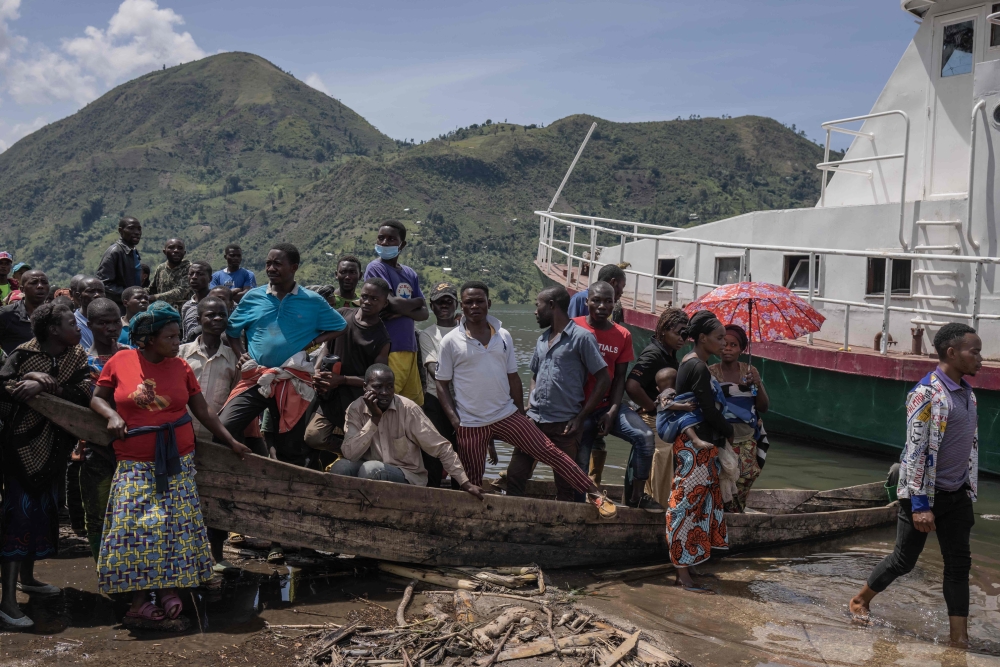 Flood-affected residents wait for the distribution of aid from the central government of the Democratic Republic of Congo, four days after floods and landslides triggered by heavy rains killed at least 400, in Nyamukubi, eastern Democratic Republic of Congo, on May 9, 2023. Photo by Guerchom Ndebo / AFP
