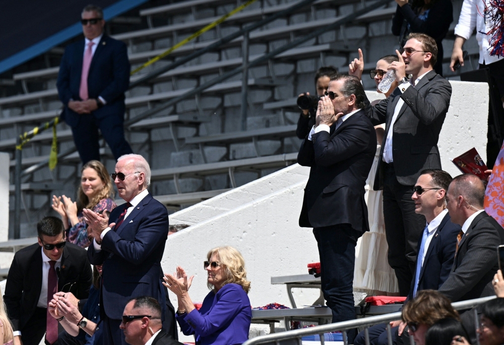 US President Joe Biden, US First Lady Jill Biden, and Hunter Biden applaud during Maisy Biden's graduation from the University of Pennsylvania at Franklin Field in Philadelphia, Pennsylvania, on May 15, 2023. (Photo by Brendan Smialowski / AFP)