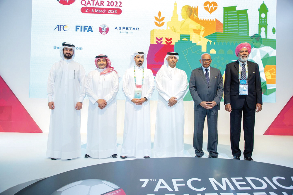 Officials of Qatar Football Association, Asian Football Confederation and Aspetar pose for a photograph.