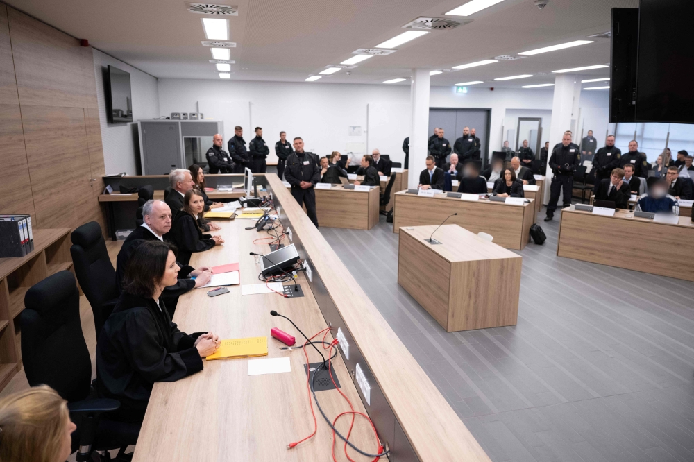 Andreas Ziegel (2nd L), presiding judge at the Higher Regional Court in Dresden, eastern Germany, sits in front of defendants prior to a hearing on May 16, 2023 in the trial over a jewellery heist on the Green Vault (Gruenes Gewoelbe) museum in Dresden's Royal Palace in November 2019. Photo by Sebastian Kahnert / POOL / AFP