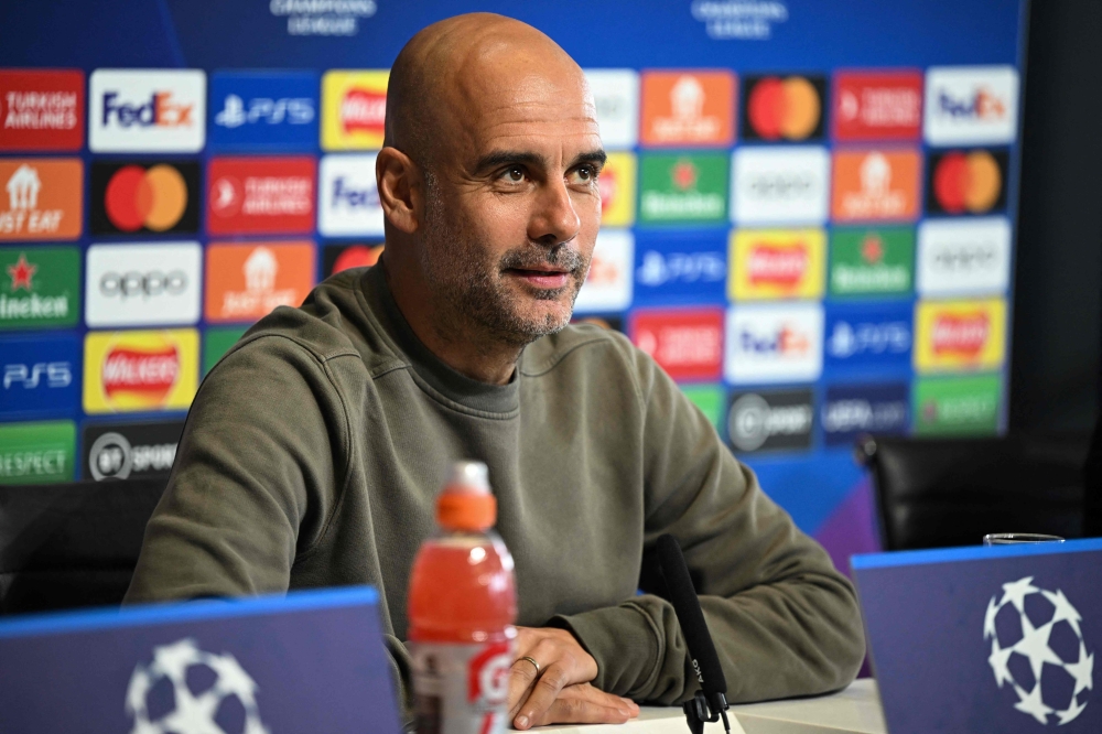 Manchester City's Spanish manager Pep Guardiola attends a press conference at Manchester City training ground in Manchester, north-west England on May 16, 2023, on the eve of their UEFA Champions League semi-final second leg football match against Real Madrid. (Photo by Oli SCARFF / AFP)