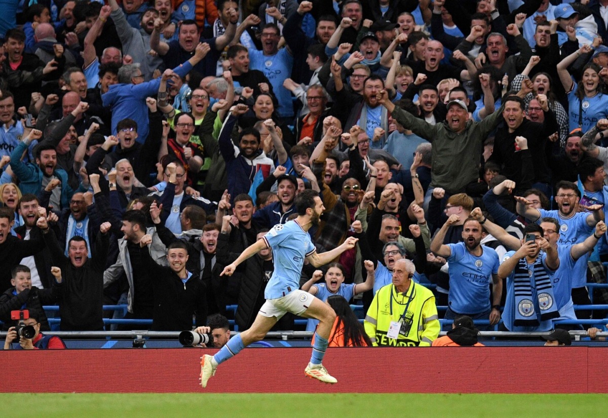 Manchester City’s Portuguese midfielder Bernardo Silva celebrates after scoring the team’s second goal during the UEFA Champions League second leg semi-final football match between Manchester City and Real Madrid at the Etihad Stadium in Manchester, north west England, on May 17, 2023. (Oli SCARFF / AFP)
