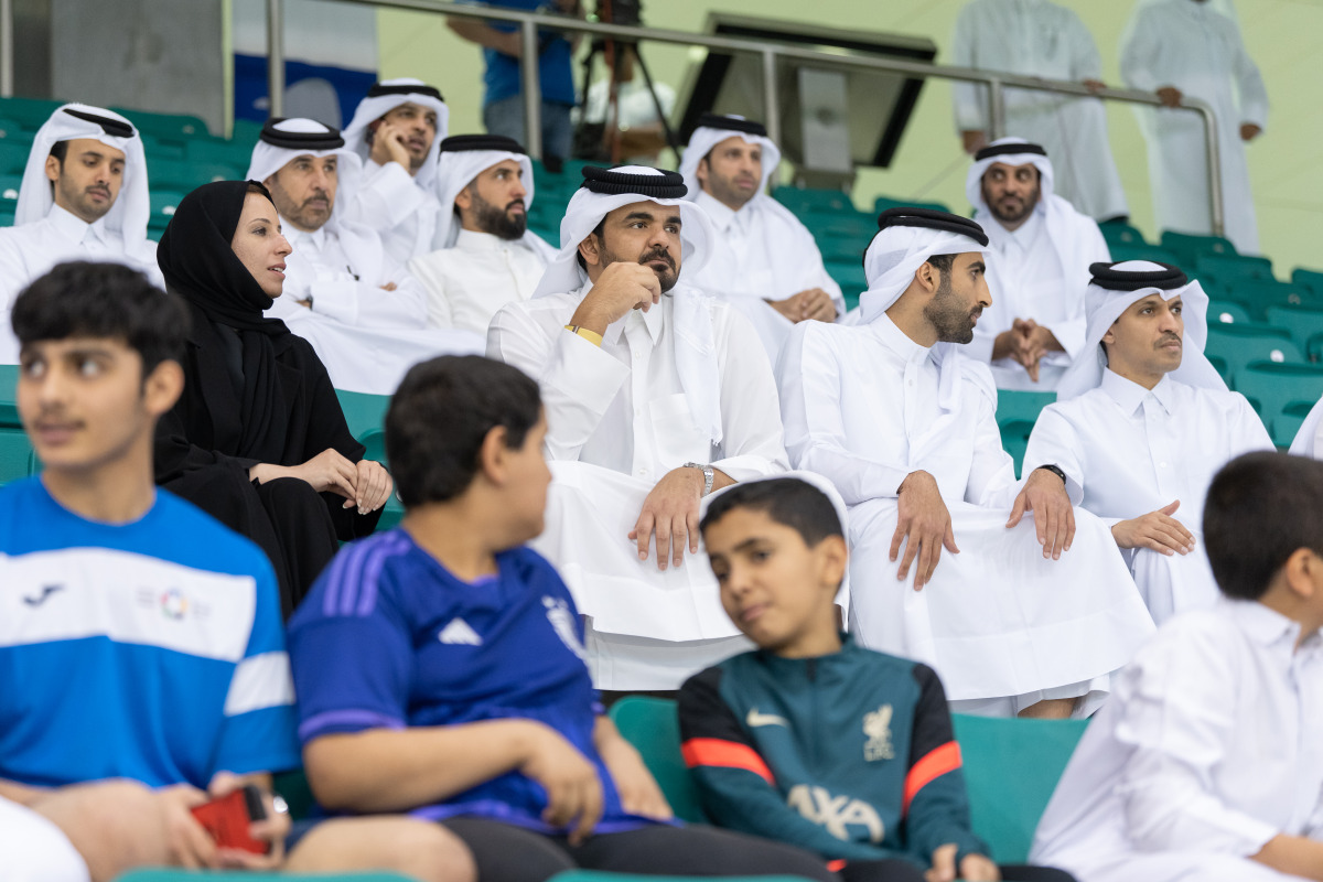 QOC President H E Sheikh Joaan bin Hamad Al Thani, Minister of Education and Higher Education 
 H E Buthaina bint Ali Al Jabr Al Nuaimi and QOC Secretary General Jassim Rashid Al Buenain along with other officials attending Schools Olympic Program competitions at Aspire Dome yesterday. 