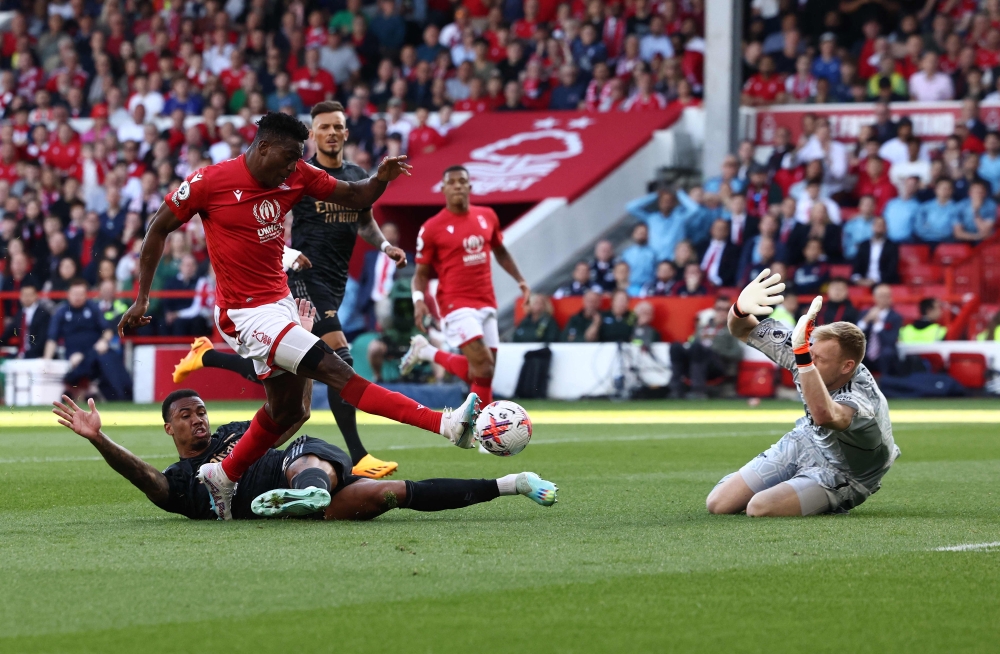Nottingham Forest's Nigerian striker Taiwo Awoniyi scores the opening goal during the English Premier League football match between Nottingham Forest and Arsenal at The City Ground in Nottingham, central England, on May 20, 2023. (Photo by Darren Staples / AFP)