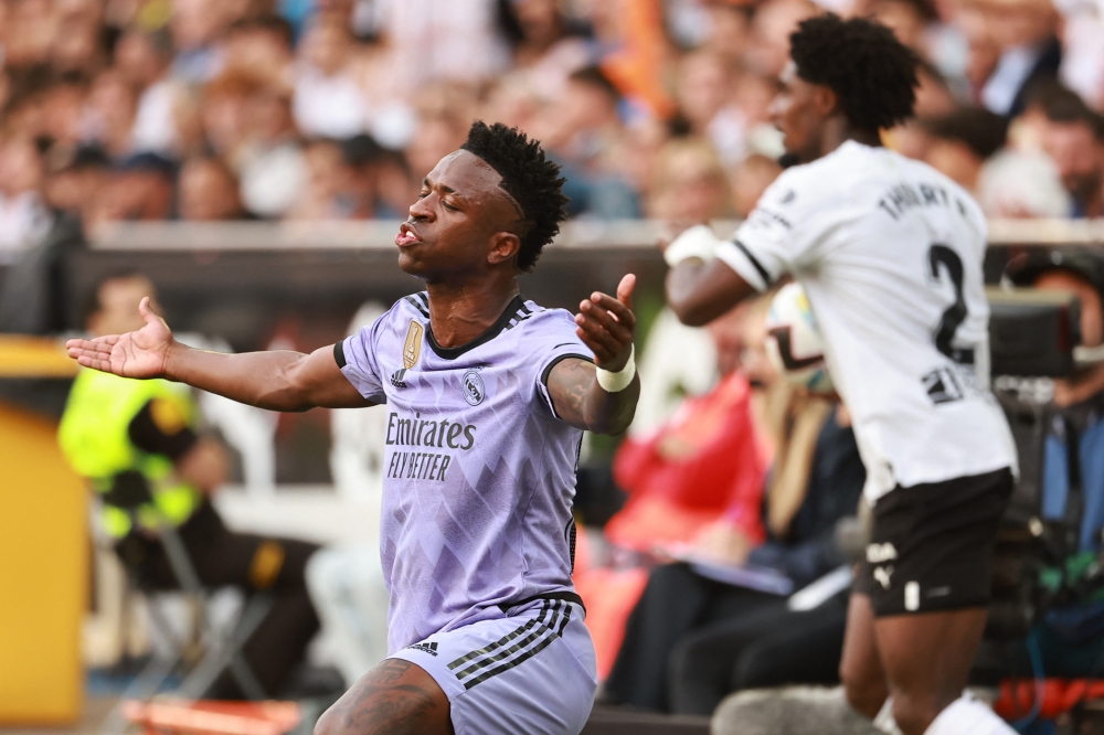 Real Madrid's Brazilian forward Vinicius Junior reacts during the Spanish league football match between Valencia CF and Real Madrid CF at the Mestalla stadium in Valencia on May 21, 2023. (Photo by Jose Jordan / AFP)