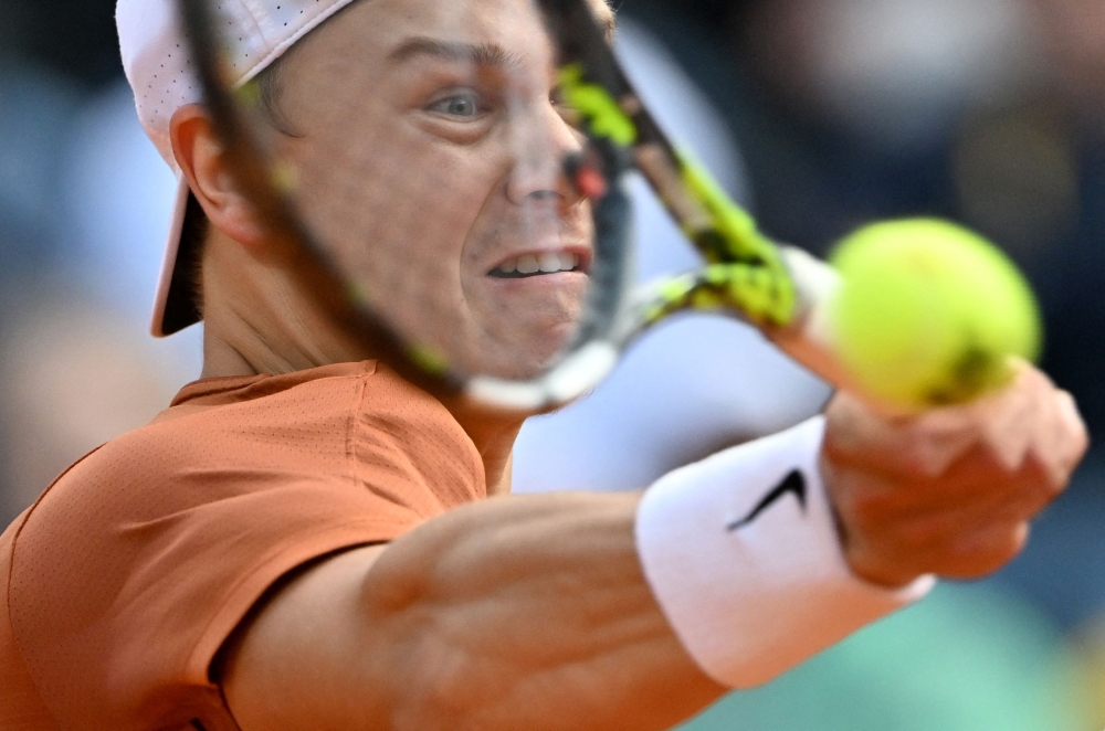 Denmark's Holger Rune returns to Russia's Daniil Medvedev during to the final of the Men's ATP Rome Open tennis tournament on the central court of Foro Italico in Rome on May 21, 2023. Photo by Tiziana FABI / AFP
