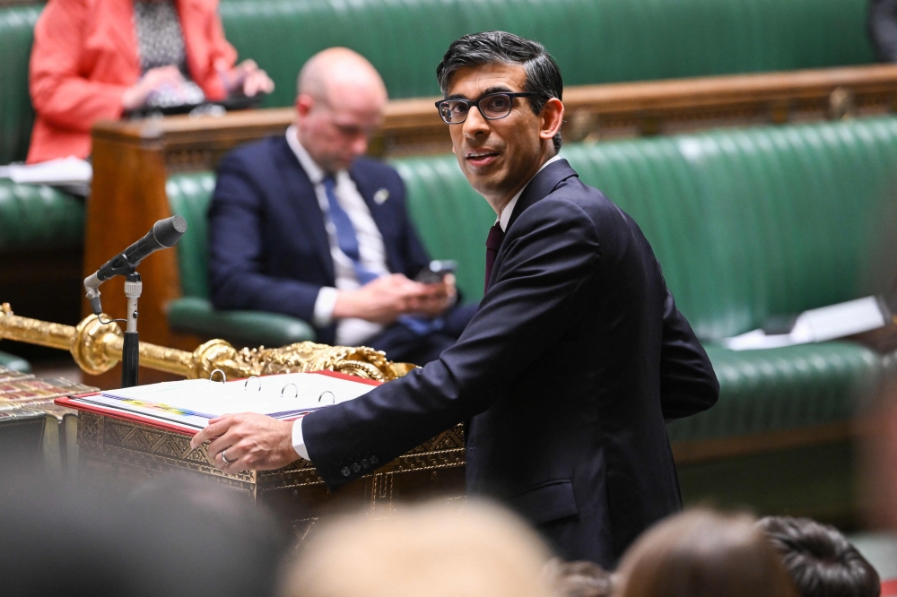 A handout photograph released by the UK Parliament shows Britain's Prime Minister Rishi Sunak answering a question after making a statement in the House of Commons in London on May 22, 2023. (Photo by JESSICA TAYLOR / UK PARLIAMENT / AFP)