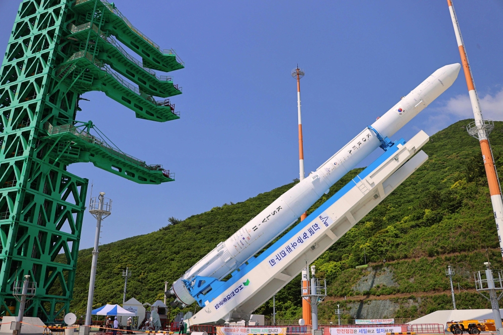 This handout photo taken on May 23, 2023 and provided by Korea Aerospace Research Institute (KARI) shows South Korea's homegrown space rocket Nuri moving to its launch pad at the Naro Space Centre in the southern coastal village of Goheung, a day before its third attempt to put satellites into orbit. Photo by Handout / Korea Aerospace Research Institute (KARI) / AFP