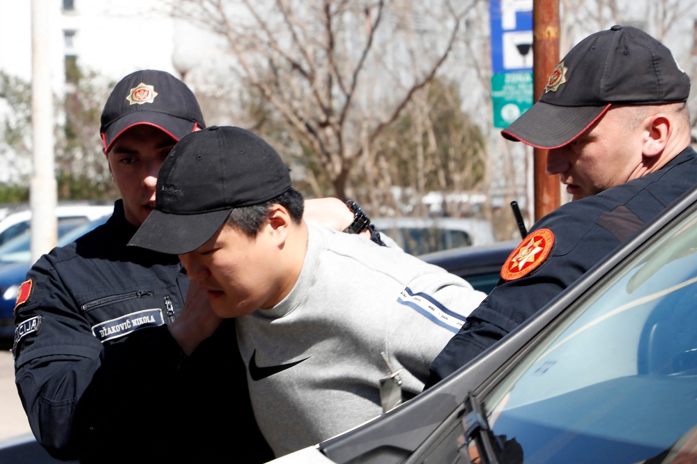 File photo: South Korean cryptocurrency entrepreneur co-founder of Terraform Labs (Terra Luna), Do Kwon (C) is taken to court after being arrested at the airport on March 24, 2023 in Podgorica.

