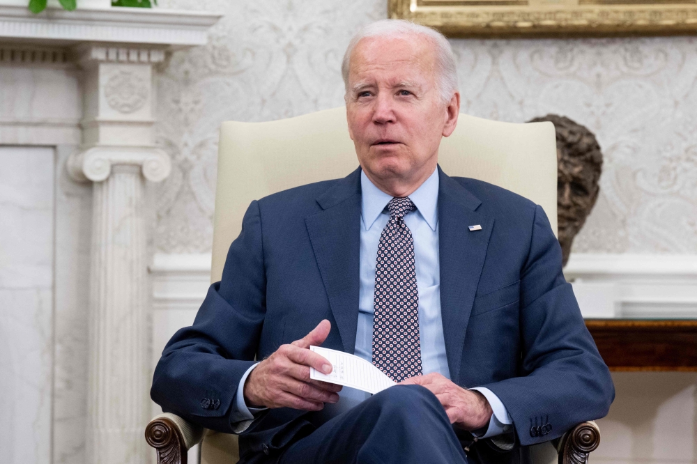 US President Joe Biden speaks during a meeting on the debt ceiling with US House Speaker Kevin McCarthy (R-CA), not pictured, in the Oval Office of the White House in Washington, DC, on May 22, 2023. (Photo by SAUL LOEB / AFP)
