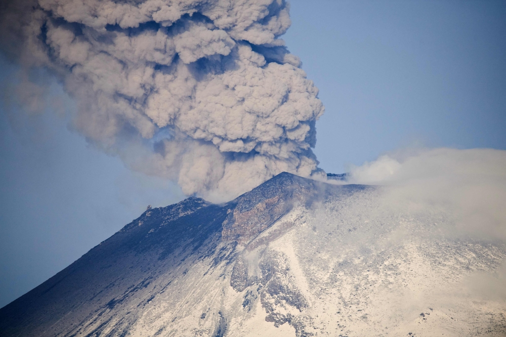 Ash and smoke billow from the Popocatepetl volcano as seen from the Santiago Xalitzintla community, state of Puebla, Mexico, on May 24, 2023. Photos by CLAUDIO CRUZ / AFP