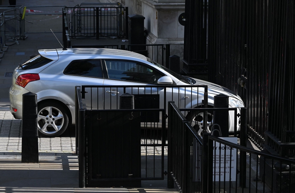 A car that was driven into the gates of 10 Downing Street, the official residence of Britain's Prime Minister, is pictured in central London on May 25, 2023. (Photo by JUSTIN TALLIS / AFP)