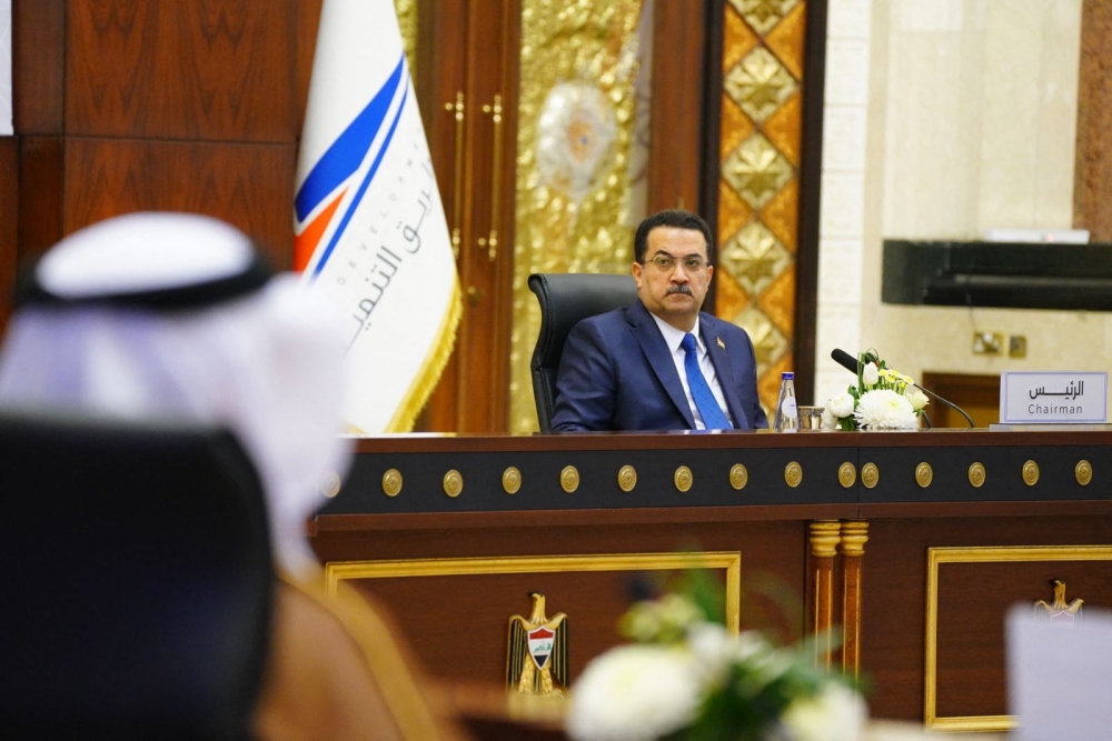 A handout picture released by Iraq's Prime Minister's Media Office shows Iraqi Prime Minister Mohamed Shia al-Sudani attending a meeting with transport ministry representatives in Baghdad on May 27, 2023. (Photo by Iraqi Prime Minister's Press Office / AFP) 