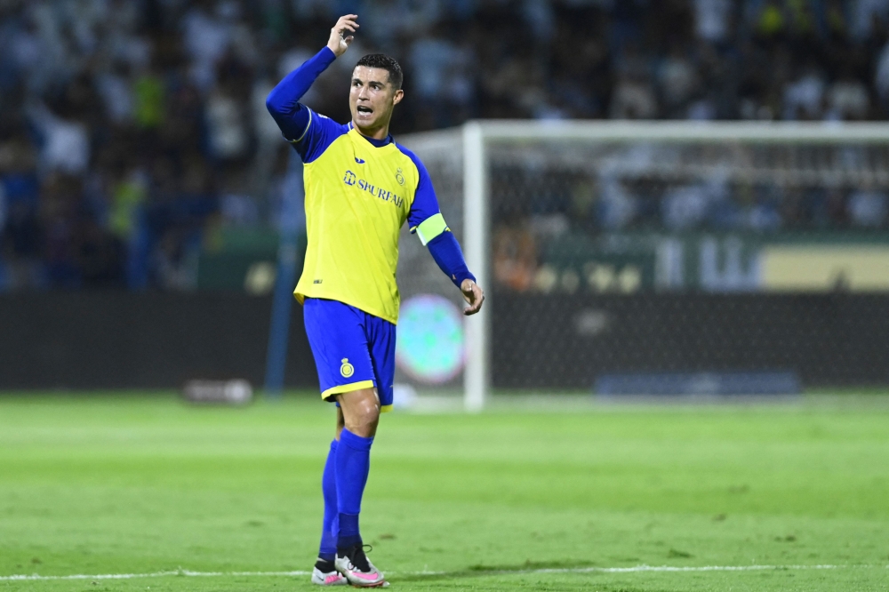 Nassr's Portuguese forward Cristiano Ronaldo gestures during the Saudi Pro League football match between Al-Nassr and Al-Ettifaq . (Photo by AFP)
