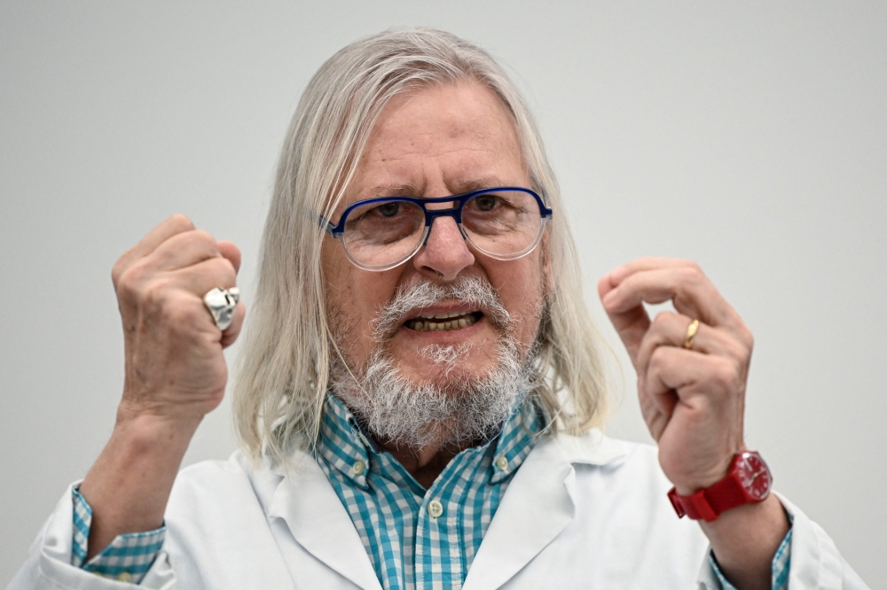 File Photo: French virologist Didier Raoult addresses a press conference on Covid-19 at the IHU medical institute in Marseille on April 20, 2022. (Photo by Christophe SIMON / AFP)